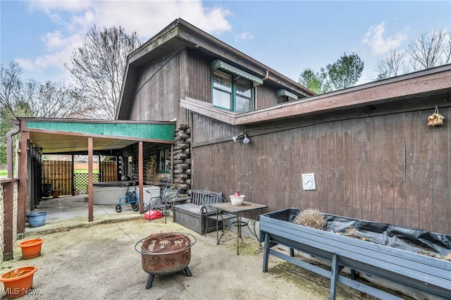24455 Tryon Rd, Bedford, OH 44146 - rear view of house featuring a patio area, a fire pit, and fence