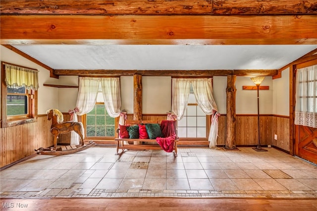 24455 Tryon Rd, Bedford, OH 44146 - living area with vaulted ceiling, wood walls, and wainscoting