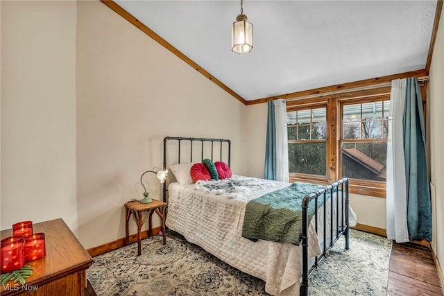 24455 Tryon Rd, Bedford, OH 44146 - bedroom featuring crown molding, lofted ceiling, baseboards, and wood finished floors