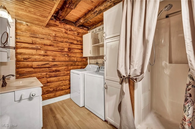 24455 Tryon Rd, Bedford, OH 44146 - laundry room with rustic walls, a sink, wood ceiling, separate washer and dryer, and laundry area