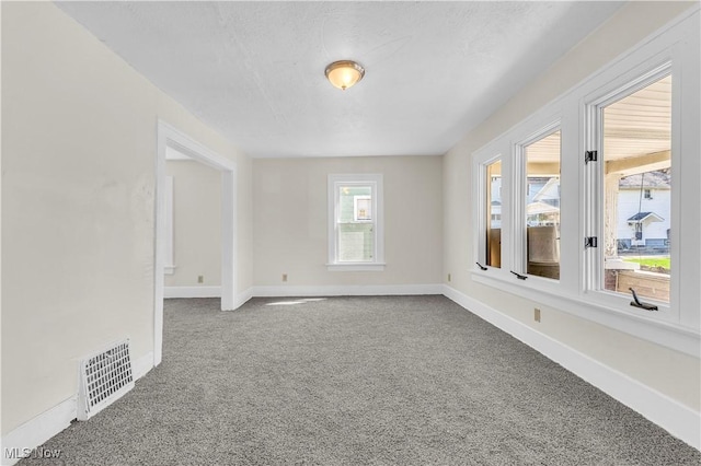 201 Alberti Ct, Akron, OH 44310 - spare room featuring carpet floors and baseboards