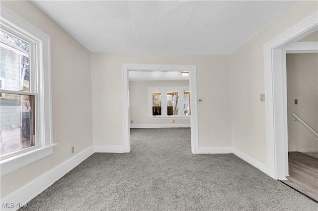201 Alberti Ct, Akron, OH 44310 - carpeted empty room with plenty of natural light and baseboards