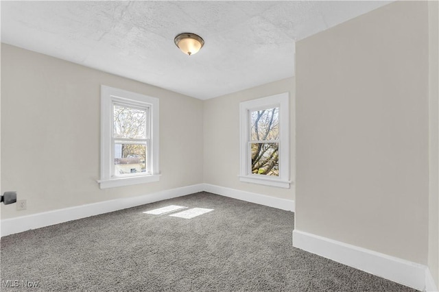 201 Alberti Ct, Akron, OH 44310 - carpeted spare room featuring plenty of natural light, baseboards, and a textured ceiling