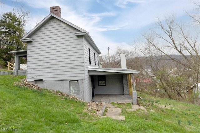 view of property exterior with a chimney