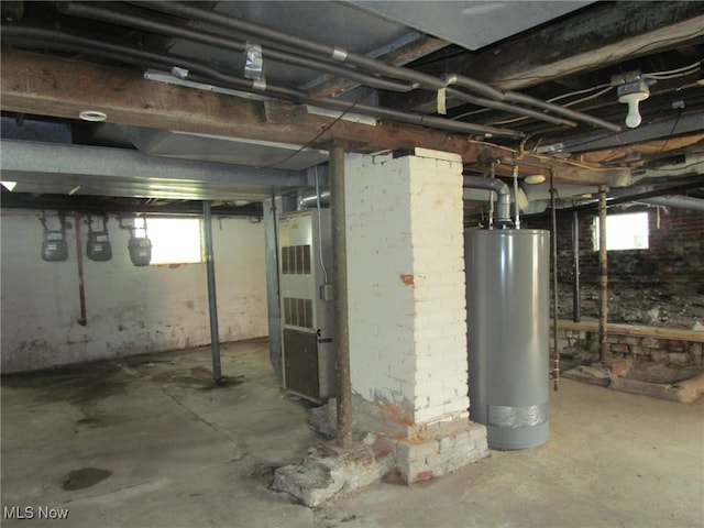 below grade area with heating unit and gas water heater