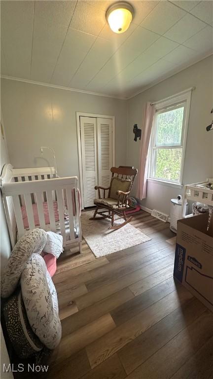 142 W Main St, Hopedale, OH 43976 - bedroom with hardwood / wood-style flooring and a closet