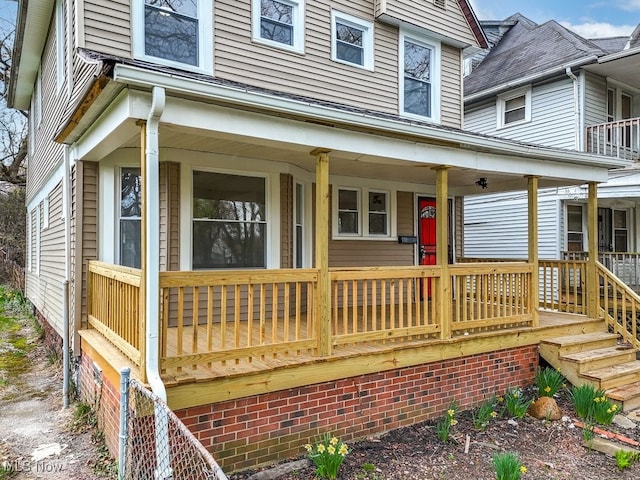 entrance to property featuring covered porch