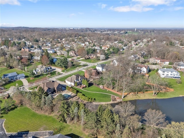 birds eye view of property featuring a water view and a residential view