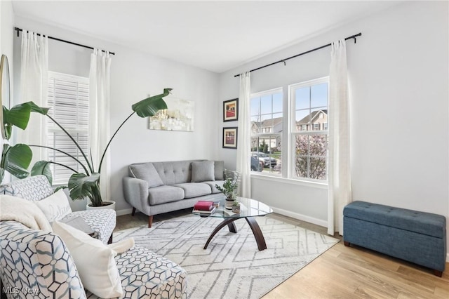 living room featuring baseboards and wood finished floors