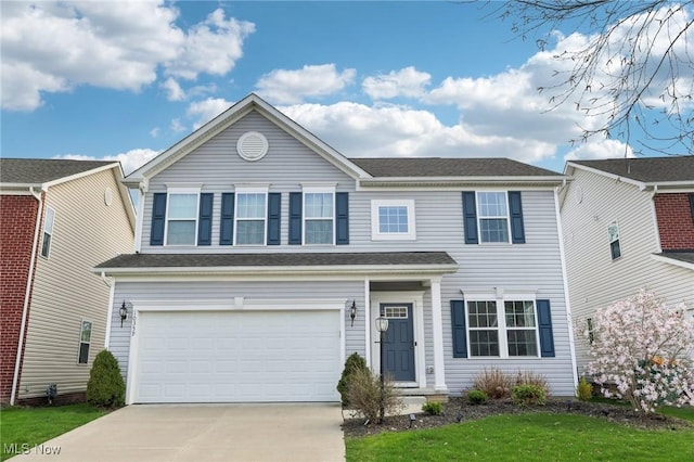 traditional home with an attached garage and driveway