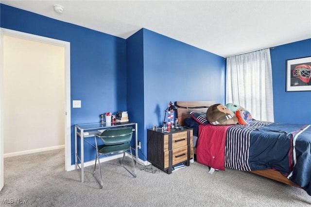 bedroom featuring carpet floors and baseboards