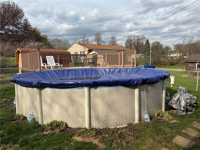 101 Sunset Ln, Follansbee, WV 26037 - view of swimming pool with a covered pool, fence, and a deck