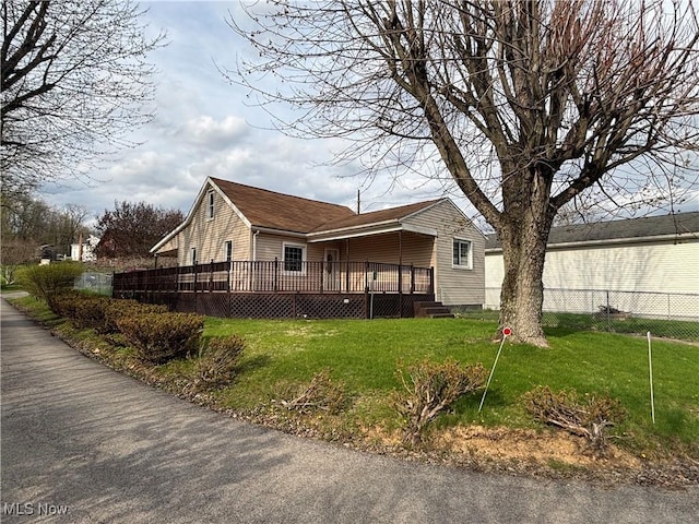 101 Sunset Ln, Follansbee, WV 26037 - view of side of property with a wooden deck, fence, and a yard