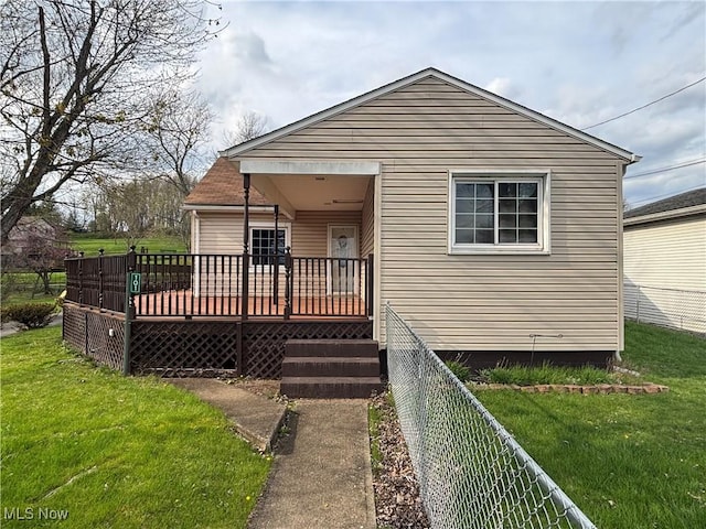101 Sunset Ln, Follansbee, WV 26037 - rear view of property with fence, a wooden deck, and a yard