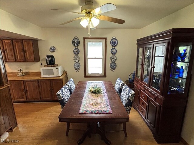 101 Sunset Ln, Follansbee, WV 26037 - dining area with light wood-style flooring and a ceiling fan