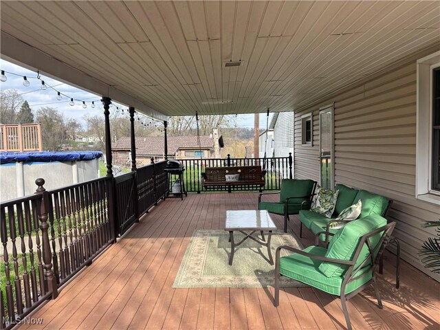 101 Sunset Ln, Follansbee, WV 26037 - deck with a covered pool and outdoor lounge area