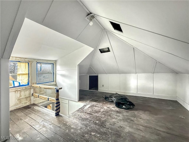 bonus room featuring hardwood / wood-style floors and vaulted ceiling