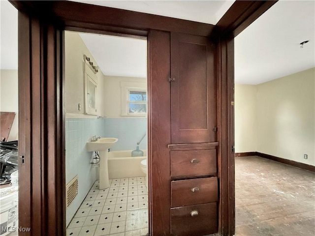 bathroom featuring toilet and visible vents