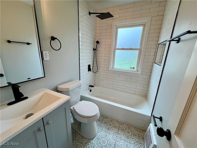 full bathroom with tile patterned floors, vanity, washtub / shower combination, and toilet