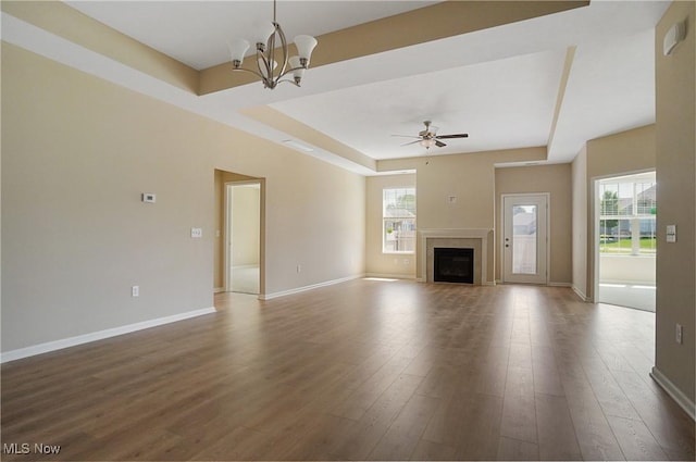 9264 Sharrott Rd Unit 1002, Poland, OH 44514 - unfurnished living room with a tray ceiling, a chandelier, wood finished floors, and a fireplace