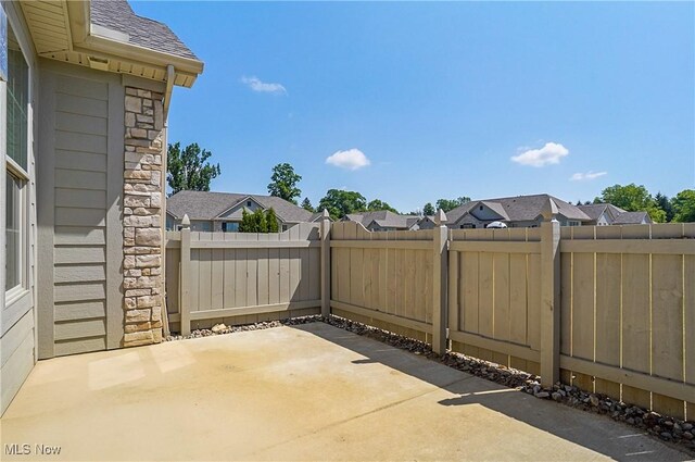 9264 Sharrott Rd Unit 1002, Poland, OH 44514 - fenced backyard with a patio area and a residential view