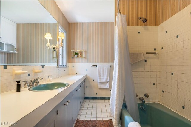 2622 Glenmont Rd NW, Canton, OH 44708 - bathroom with vanity, tile patterned floors, wallpapered walls, and tile walls