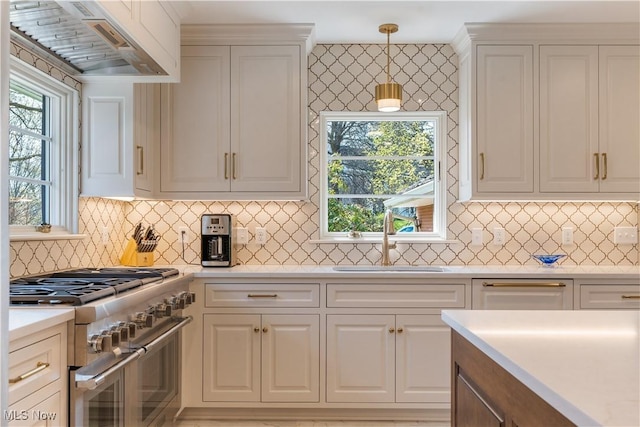 2622 Glenmont Rd NW, Canton, OH 44708 - kitchen with light countertops, a sink, double oven range, and custom range hood