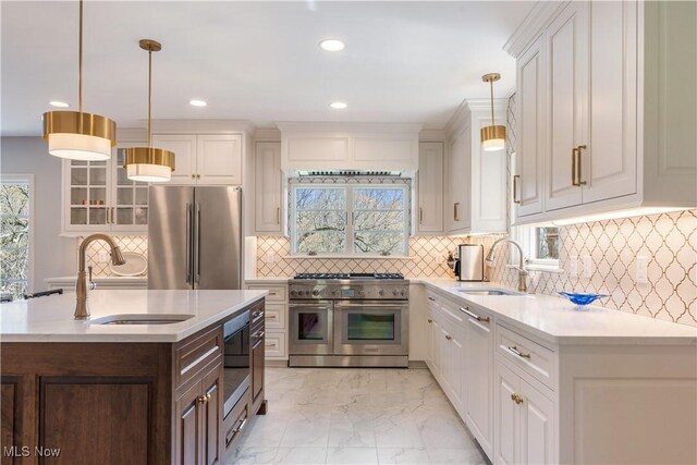 2622 Glenmont Rd NW, Canton, OH 44708 - kitchen featuring white cabinets, light countertops, a sink, and high quality appliances