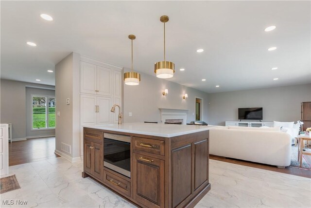 2622 Glenmont Rd NW, Canton, OH 44708 - kitchen with marble finish floor, a sink, light countertops, and recessed lighting