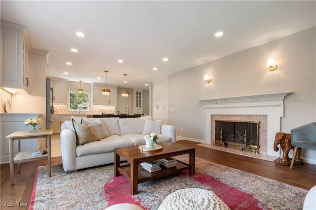 2622 Glenmont Rd NW, Canton, OH 44708 - living area with recessed lighting, a premium fireplace, and wood finished floors