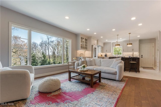 2622 Glenmont Rd NW, Canton, OH 44708 - living area with light wood-type flooring, baseboards, and recessed lighting
