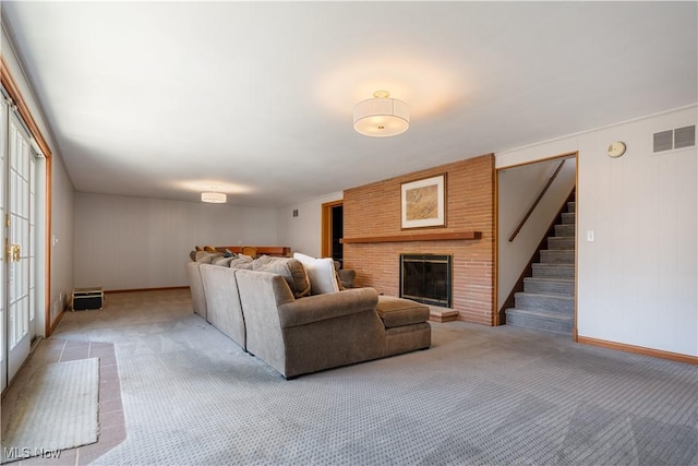 2622 Glenmont Rd NW, Canton, OH 44708 - living area featuring stairway, visible vents, baseboards, and light carpet