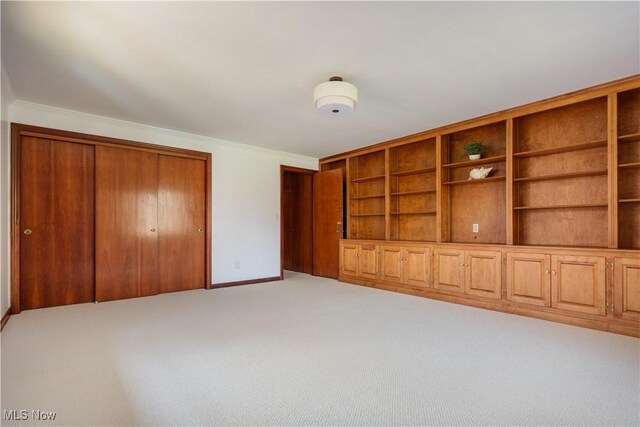 2622 Glenmont Rd NW, Canton, OH 44708 - interior space featuring baseboards, ornamental molding, and carpet
