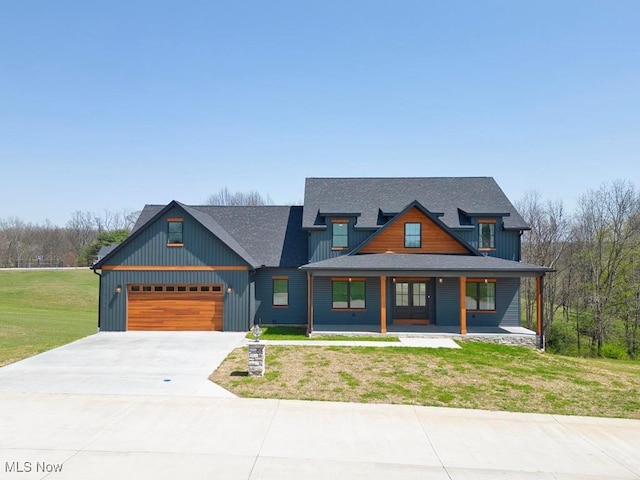 view of front of house featuring concrete driveway, a shingled roof, a porch, a front yard, and a garage