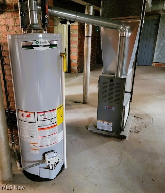 utility room with heating unit and gas water heater