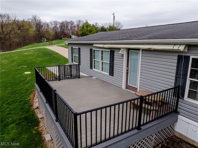 deck featuring a lawn