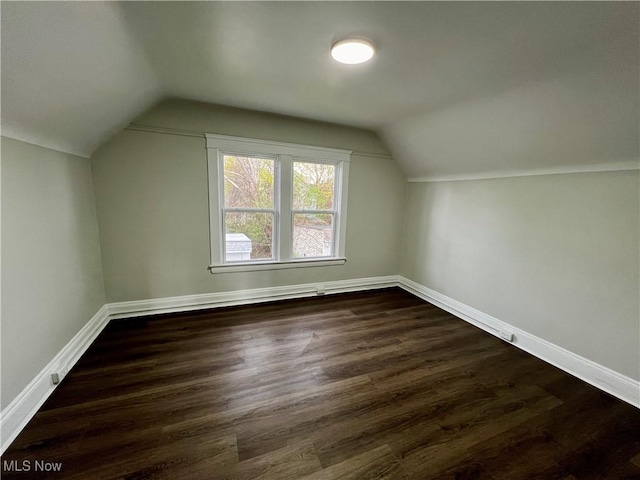 3478 E 150th St, Cleveland, OH 44120 - additional living space with vaulted ceiling, baseboards, and dark wood-type flooring