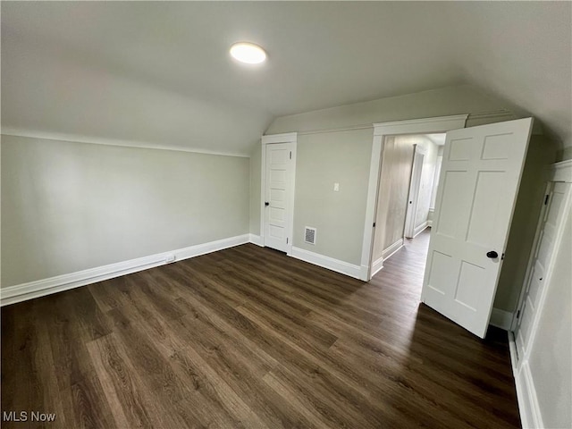 3478 E 150th St, Cleveland, OH 44120 - bonus room featuring baseboards, vaulted ceiling, visible vents, and dark wood-style floors