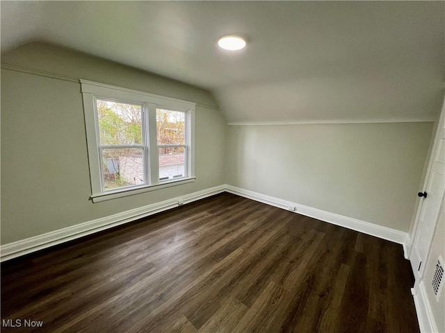 3478 E 150th St, Cleveland, OH 44120 - additional living space with vaulted ceiling, baseboards, and dark wood-type flooring