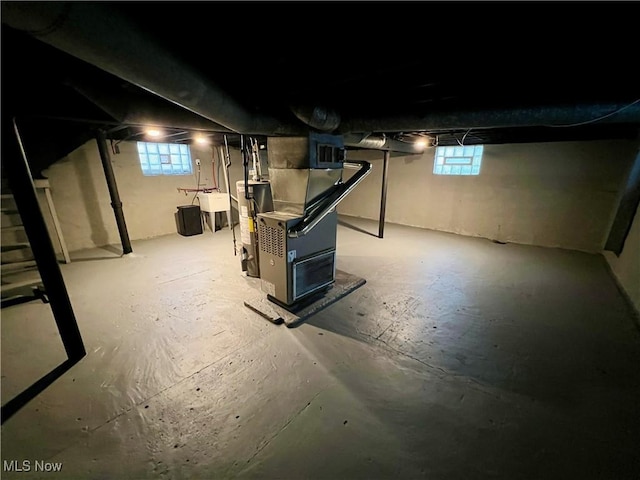 3478 E 150th St, Cleveland, OH 44120 - basement featuring water heater, a sink, and stairs