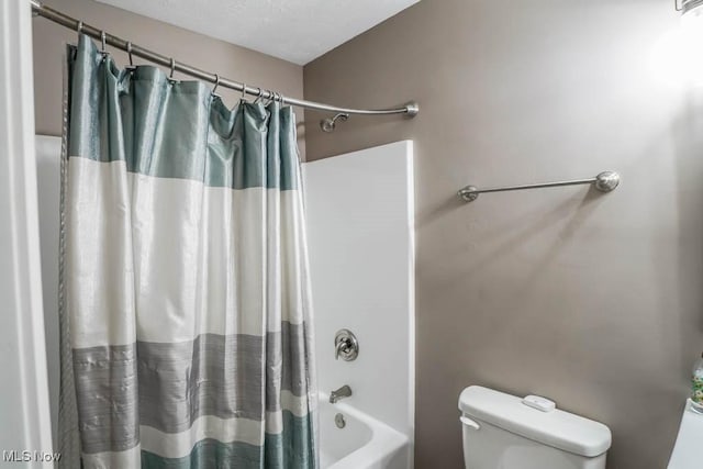 bathroom with toilet and shower / bath combo