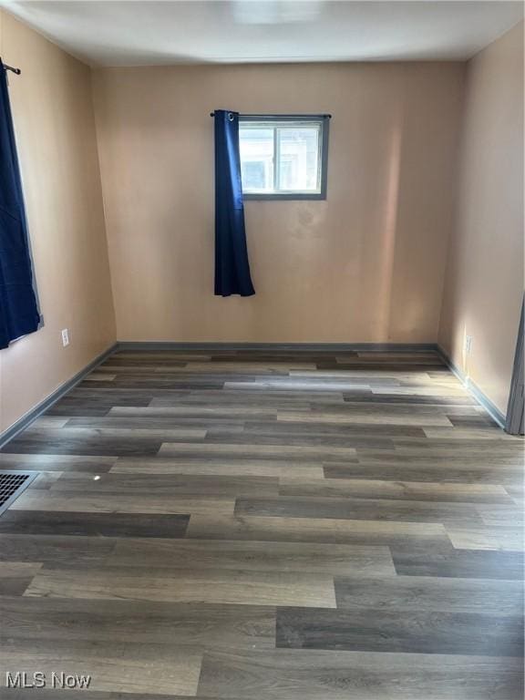 625 Allyn St, Akron, OH 44311 - spare room with baseboards and wood finished floors