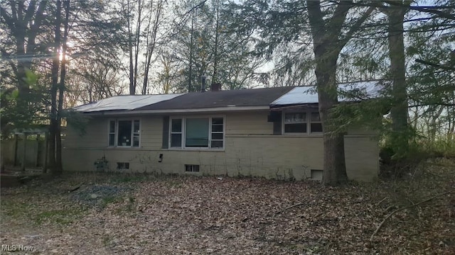 315 Loma Dr, Akron, OH 44319 - view of side of home featuring crawl space and a chimney