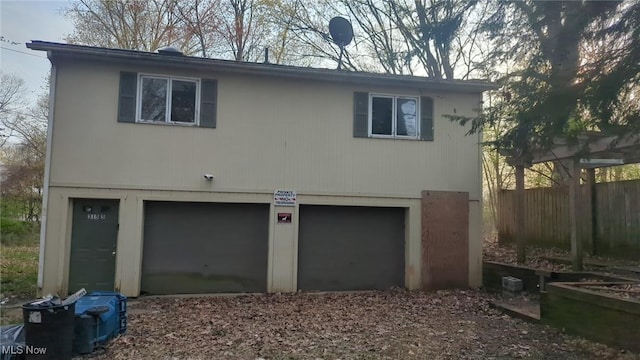 315 Loma Dr, Akron, OH 44319 - rear view of property featuring an attached garage and fence