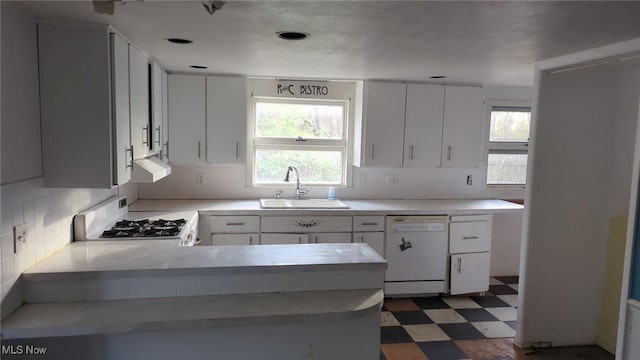 315 Loma Dr, Akron, OH 44319 - kitchen with tasteful backsplash, dark floors, a sink, white appliances, and light countertops