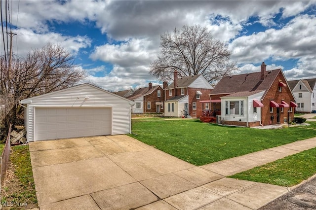 view of front of property featuring a residential view, an outbuilding, a front lawn, a garage, and crawl space