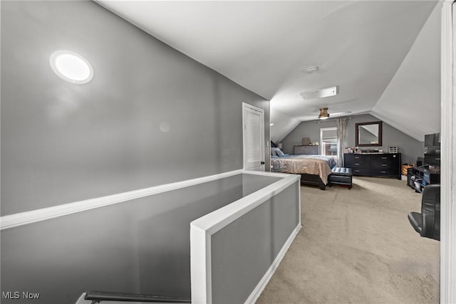 bedroom with light carpet and vaulted ceiling