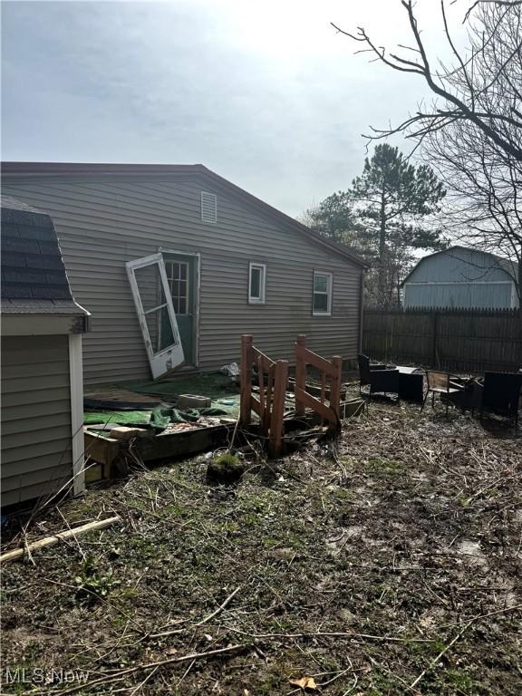 465 Stallion Ct, Lagrange, OH 44050 - rear view of house featuring fence