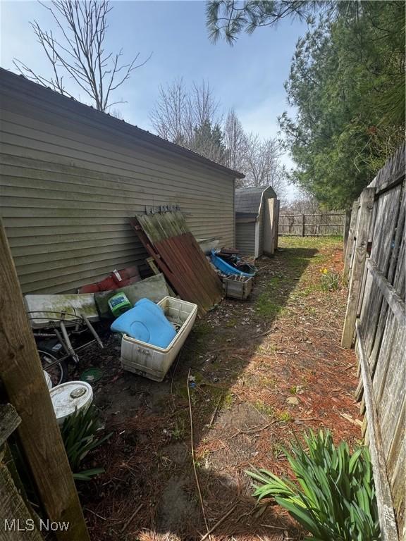 465 Stallion Ct, Lagrange, OH 44050 - view of yard with an outbuilding, a shed, and fence