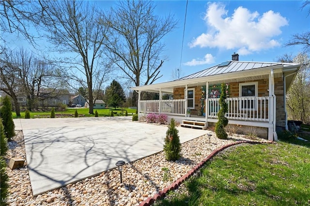 3270 S Canfield Niles Rd, Canfield, OH 44406 - rear view of property with a standing seam roof, a porch, a chimney, metal roof, and concrete driveway